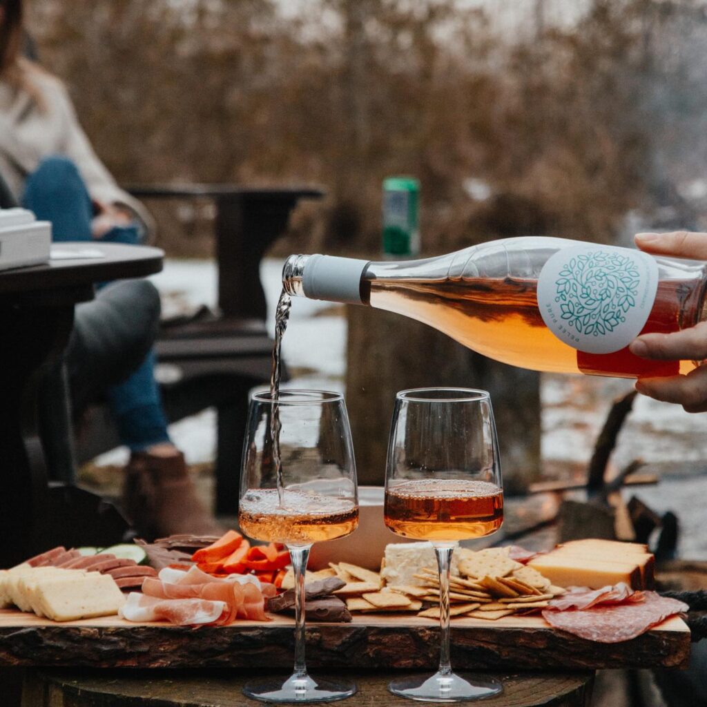 Outdoor charcuterie and wine served fireside in the wintertime